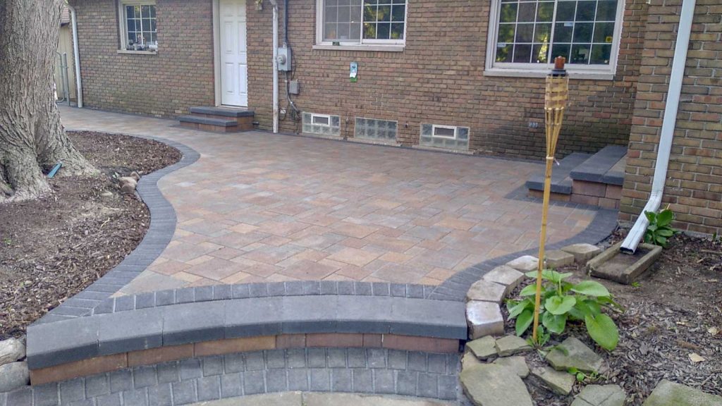 brick paver patio with step